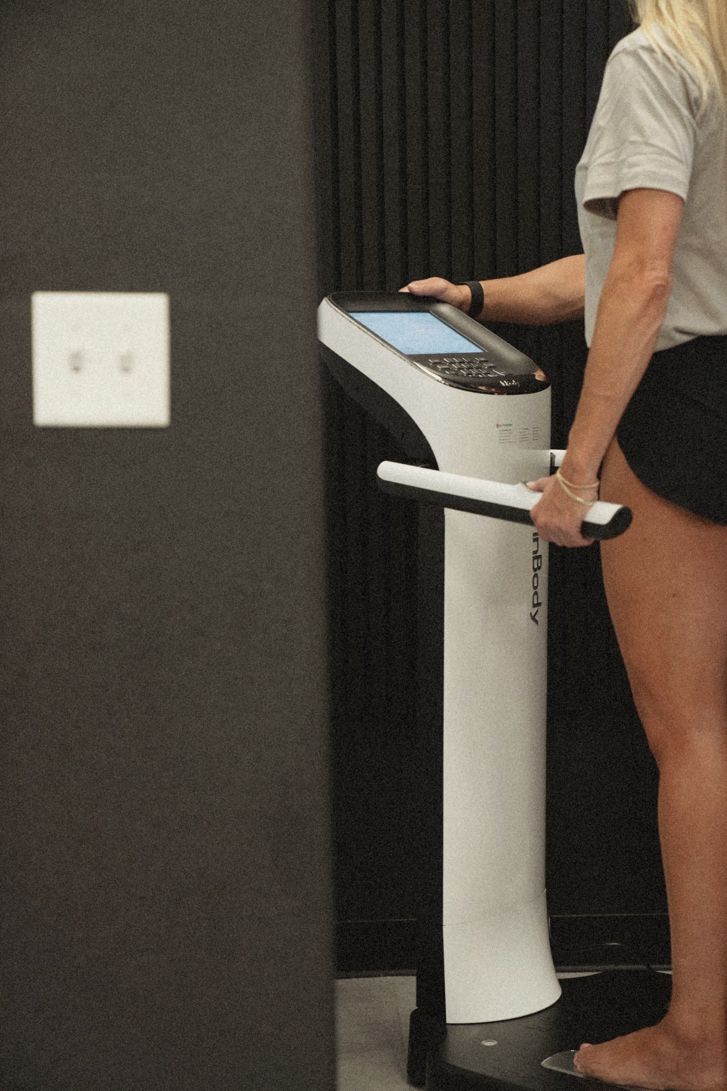 A member on the InBody scanner during a reassessment visit.