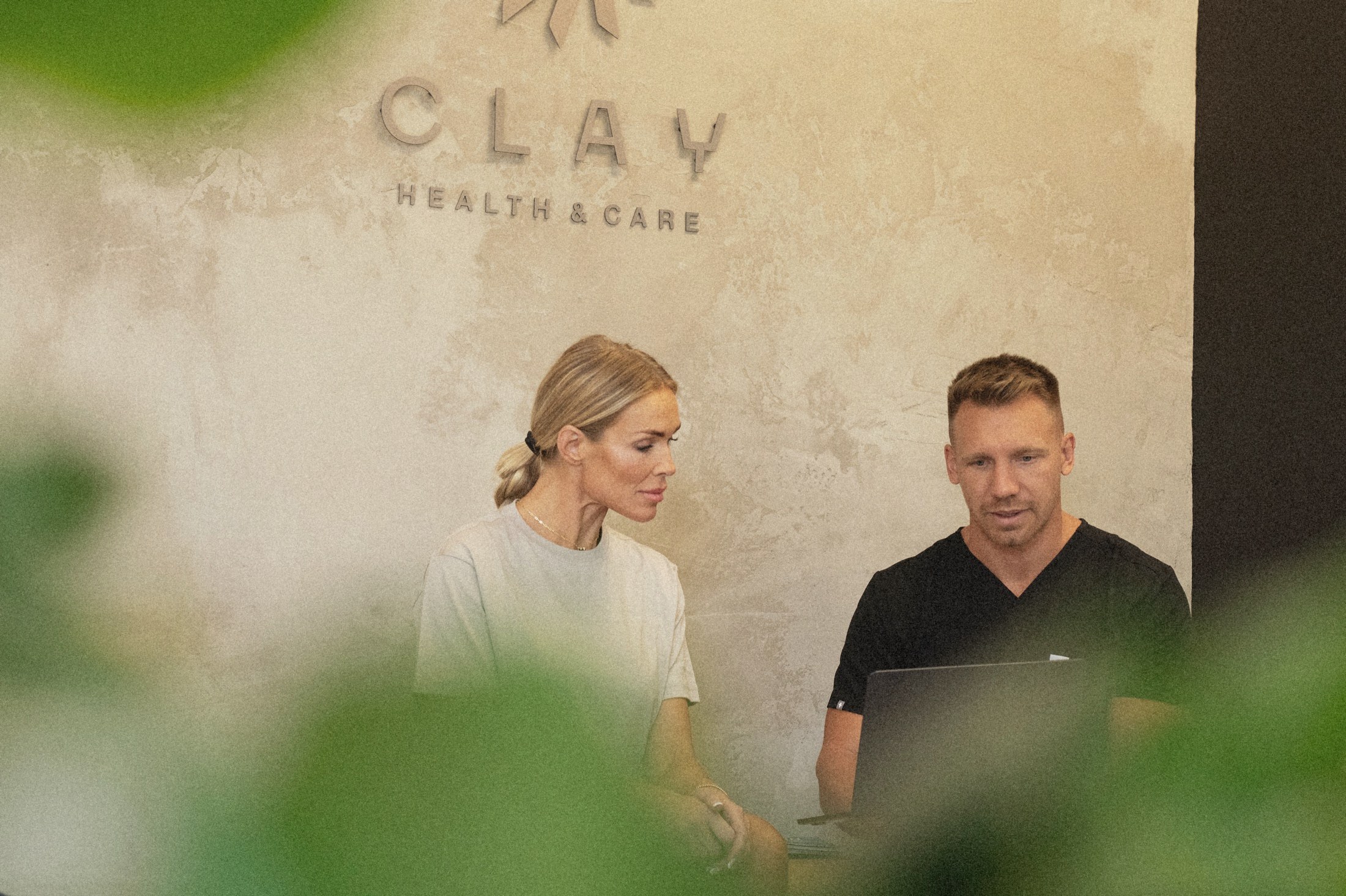 Dr. R. Allen Gorman reviewing health data with a Clay member.